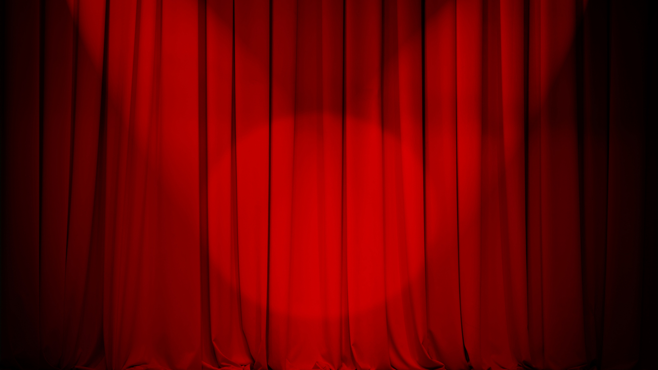 theatre red curtain with two lights cross