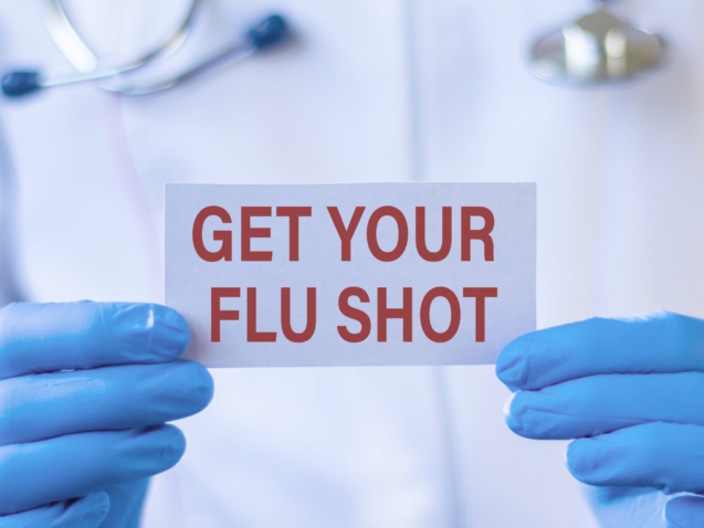 Get Your Flu Shot card in hands of Medical Doctor. Medical and health care.
