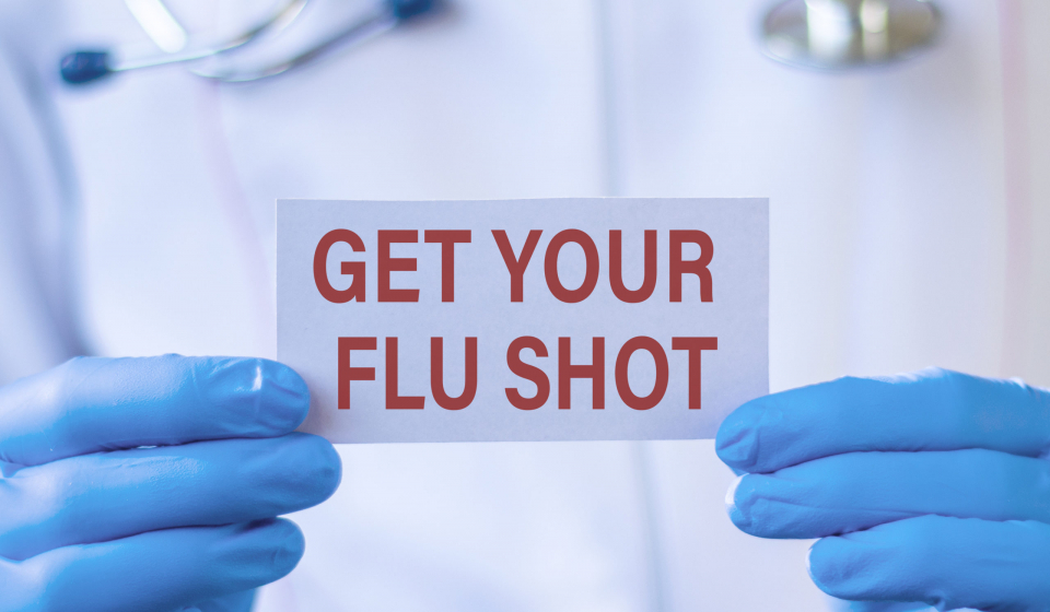 Get Your Flu Shot card in hands of Medical Doctor. Medical and health care.